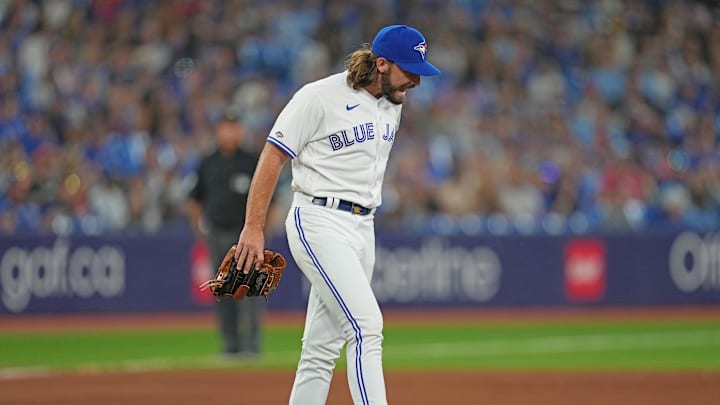 Aug 11, 2023; Toronto, Ontario, CAN; Toronto Blue Jays relief pitcher Hagen Danner (65) reacts in pain against the Chicago Cubs during the  ninth inning at Rogers Centre. Mandatory Credit: Nick Turchiaro-Imagn Images