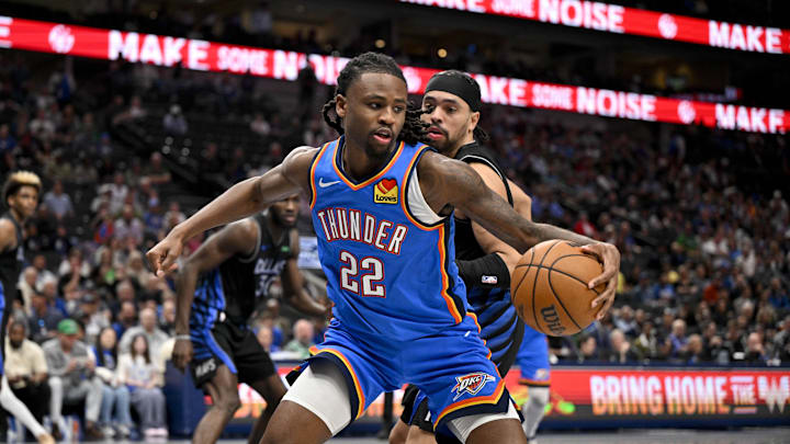Mar 1, 2026; Dallas, Texas, USA; Oklahoma City Thunder guard Cason Wallace (22) looks to move the ball past Dallas Mavericks guard Ryan Nembhard (9) during the second half at the American Airlines Center. Mandatory Credit: Jerome Miron-Imagn Images