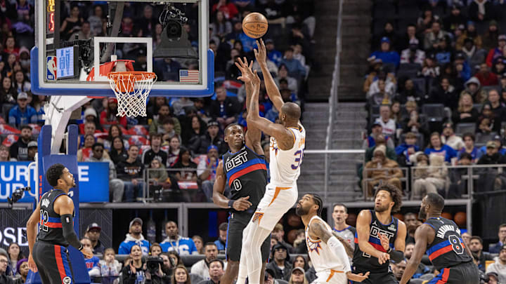 Jan 18, 2025; Detroit, Michigan, USA; Phoenix Suns forward Kevin Durant (35) shoots the ball over Detroit Pistons center Jalen Duren (0) during the first quarter at Little Caesars Arena. Mandatory Credit: David Reginek-Imagn Images