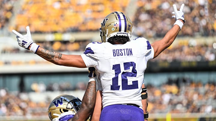 Oct 12, 2024; Iowa City, Iowa, USA; Washington Huskies wide receiver Denzel Boston (12) reacts after catching a touchdown pass during the second quarter against the Iowa Hawkeyes at Kinnick Stadium. Mandatory Credit: Jeffrey Becker-Imagn Images