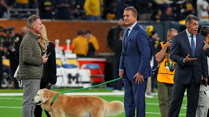 Jan 8, 2024; Houston, TX, USA; ESPN analyst  Kirk Herbstreit walks his dog Ben before the 2024 College Football Playoff national championship game between the Michigan Wolverines and the Washington Huskies at NRG Stadium. Mandatory Credit: Kirby Lee-Imagn Images