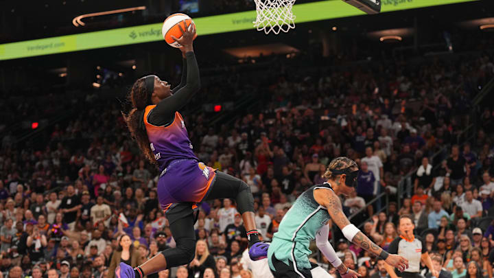 Sep 19, 2025; Phoenix, Arizona, USA; Phoenix Mercury guard Kahleah Copper (2) goes up for a layup over New York Liberty guard Natasha Cloud (9) during the second half of game three of round one for the 2025 WNBA Playoffs at PHX Arena. Mandatory Credit: Joe Camporeale-Imagn Images