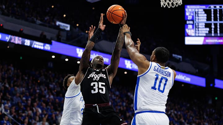Jan 14, 2025; Lexington, Kentucky, USA; Texas A&M Aggies guard Manny Obaseki (35) goes to the basket against Kentucky Wildcats forward Brandon Garrison (10) during the first half at Rupp Arena at Central Bank Center. Mandatory Credit: Jordan Prather-Imagn Images