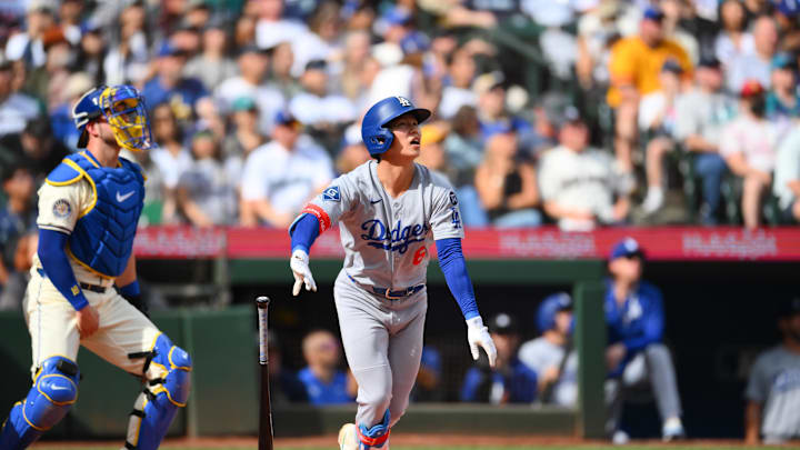 Sep 28, 2025; Seattle, Washington, USA; Los Angeles Dodgers second baseman Hyeseong Kim (6) hits a 2-run home run against the Seattle Mariners during the second inning at T-Mobile Park. Mandatory Credit: Steven Bisig-Imagn Images