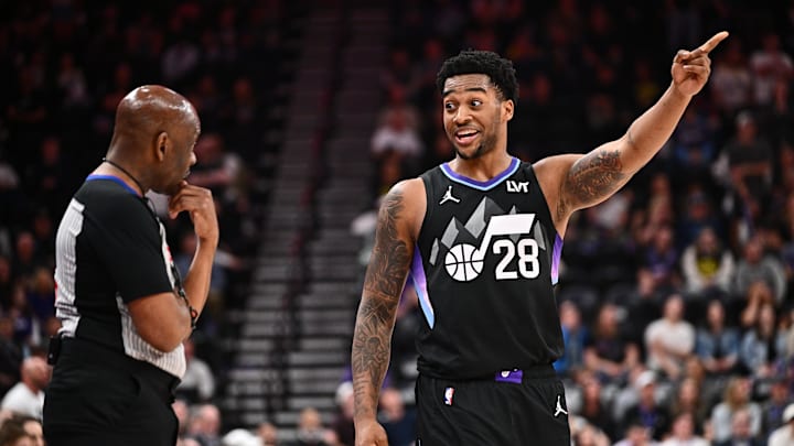 Apr 9, 2025; Salt Lake City, Utah, USA;  Utah Jazz forward Brice Sensabaugh (28) talks with referee Derek Richardson (63) during the second half of a game against the Portland Trail Blazers at Delta Center. Mandatory Credit: Jamie Sabau-Imagn Images