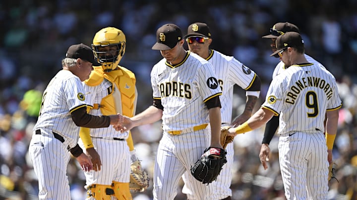 Mar 27, 2025; San Diego, California, USA; San Diego Padres starting pitcher Michael King (34), center, leaves the game during the third inning of a baseball game against the Atlanta Braves at Petco Park. Mandatory Credit: Denis Poroy-Imagn Images Mar 27, 2025; San Diego, California, USA; San Diego Padres starting pitcher Michael King (34), center, leaves the game during the third inning of a baseball game against the Atlanta Braves at Petco Park. Mandatory Credit: Denis Poroy-Imagn Images