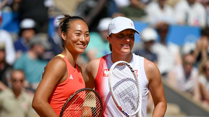 Qinwen Zheng and Iga Swiatek before their match at the 2024 Paris Summer Olympics. Qinwen Zheng and Iga Swiatek before their match at the 2024 Paris Summer Olympics.