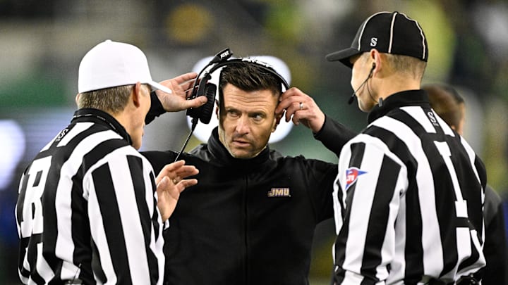 Dec 20, 2025; Eugene, OR, USA;  James Madison Dukes head coach Bob Chesney speaks with the referees during the fourth quarter against the Oregon Ducks at Autzen Stadium. Mandatory Credit: Troy Wayrynen-Imagn Images