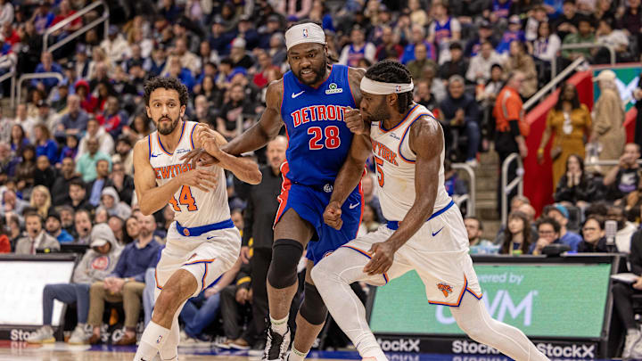 Apr 10, 2025; Detroit, Michigan, USA; Detroit Pistons center Isaiah Stewart (28) battles for position New York Knicks forward Precious Achiuwa (5) and guard Landry Shamet (44) during the second half at Little Caesars Arena. Mandatory Credit: David Reginek-Imagn Images