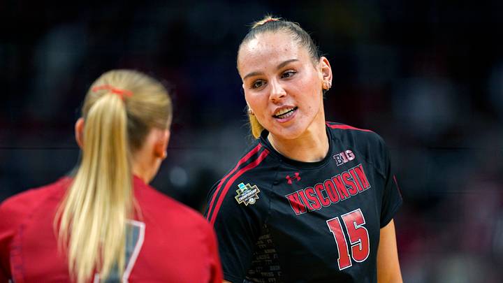 Dec 18, 2025; Kansas City, MO, USA; Wisconsin Badgers outside hitter Mimi Colyer (15) talks to libero/defensive specialist Kristen Simon (7) prior to a 2025 NCAA Women’s Volleyball Championship semifinal match against the Kentucky Wildcats at T-Mobile Center. Mandatory Credit: Jay Biggerstaff-Imagn Images