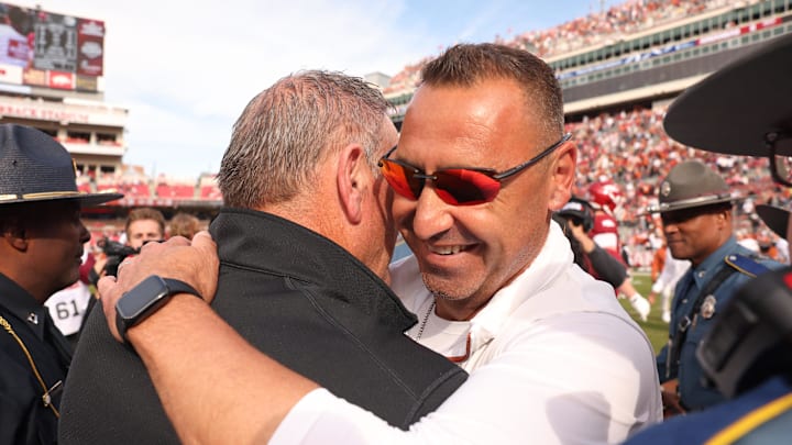 Nov 16, 2024; Fayetteville, Arkansas, USA; Texas Longhorns head coach Steve Sarkisian hugs Arkansas Razorbacks head coach Sam Pittman after the game at Donald W. Reynolds Razorback Stadium. Texas won 20-10. Mandatory Credit: Nelson Chenault-Imagn Images Nov 16, 2024; Fayetteville, Arkansas, USA; Texas Longhorns head coach Steve Sarkisian hugs Arkansas Razorbacks head coach Sam Pittman after the game at Donald W. Reynolds Razorback Stadium. Texas won 20-10. Mandatory Credit: Nelson Chenault-Imagn Images
