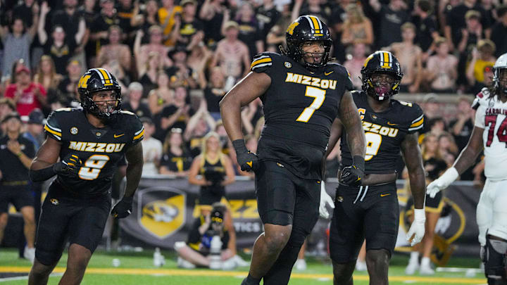 Sep 20, 2025; Columbia, Missouri, USA; Missouri Tigers defensive tackle Chris McClellan (7) celebrates against the South Carolina Gamecocks after a sack during the first half of the game at Faurot Field at Memorial Stadium. Mandatory Credit: Denny Medley-Imagn Images