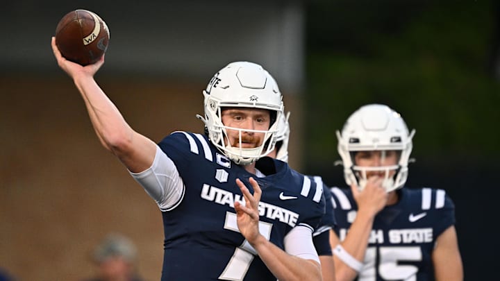 Oct 11, 2024; Logan, Utah, USA;  Utah State Aggies quarterback Spencer Petras (7) warms up before a game against the UNLV Rebels at Merlin Olsen Field at Maverik Stadium. Mandatory Credit: Jamie Sabau-Imagn Images