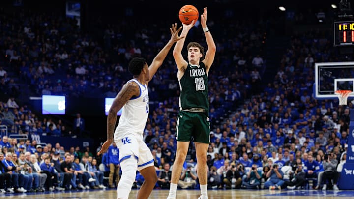 Nov 21, 2025; Lexington, Kentucky, USA; Loyola (MD) Greyhounds forward Emmett Adair (18) shoots the ball against Kentucky Wildcats forward Brandon Garrison (10) during the first half at Rupp Arena at Central Bank Center. Mandatory Credit: Jordan Prather-Imagn Images
