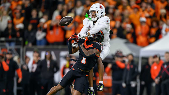 Nov 23, 2024; Corvallis, Oregon, USA; Washington State Cougars defensive back Stephen Hall (1) is called for pass interference while defending a pass intended for Oregon State Beavers wide receiver Darrius Clemons (1) during the second quarter at Reser Stadium. Mandatory Credit: Craig Strobeck-Imagn Images