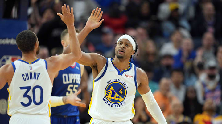 Golden State Warriors guard Moses Moody (4) celebrates with guard Stephen Curry (30) during the third quarter against the LA Clippers at Chase Center. Mandatory Credit: Darren Yamashita-Imagn Images