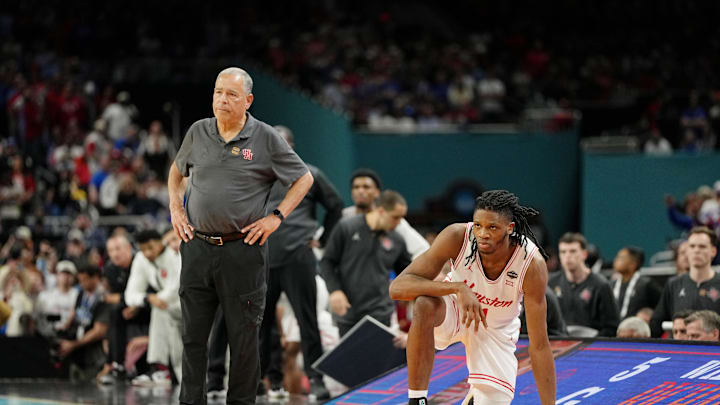 Apr 7, 2025; San Antonio, TX, USA; Houston Cougars head coach Kelvin Sampson and forward Joseph Tugler (11) look on against the Florida Gators during the second half of the national championship game of the Final Four of the 2025 NCAA Tournament at the Alamodome. Mandatory Credit: Bob Donnan-Imagn Images