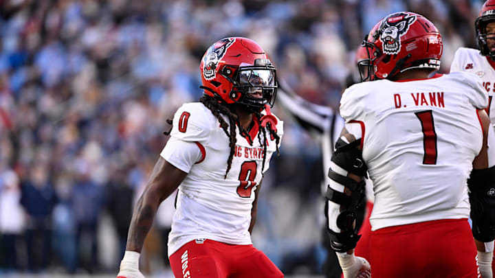 Nov 30, 2024; Chapel Hill, North Carolina, USA; North Carolina State Wolfpack linebacker Sean Brown (0) reacts after recovering a fumble in the first quarter at Kenan Memorial Stadium. Mandatory Credit: Bob Donnan-Imagn Images