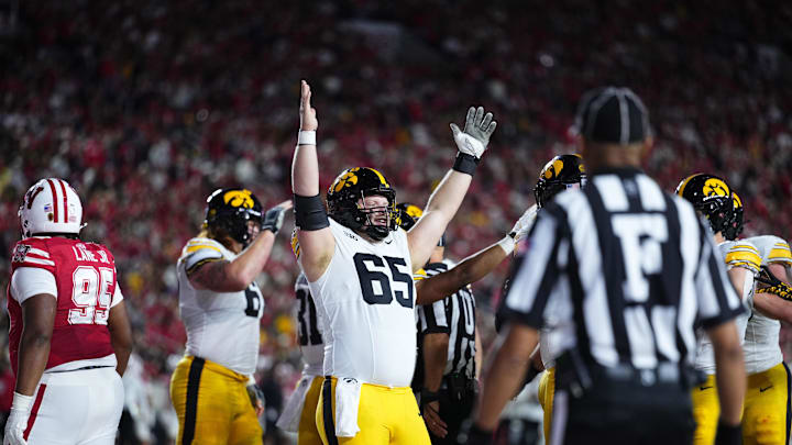 Oct 11, 2025; Madison, Wisconsin, USA; Iowa Hawkeyes offensive lineman Logan Jones (65) celebrates a touchdown in the first half against the Wisconsin Badgers at Camp Randall Stadium. Mandatory Credit: Ross Harried-Imagn Images Oct 11, 2025; Madison, Wisconsin, USA; Iowa Hawkeyes offensive lineman Logan Jones (65) celebrates a touchdown in the first half against the Wisconsin Badgers at Camp Randall Stadium. Mandatory Credit: Ross Harried-Imagn Images