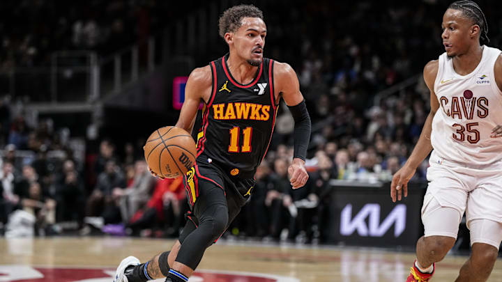 Jan 20, 2024; Atlanta, Georgia, USA; Atlanta Hawks guard Trae Young (11) dribbles against Cleveland Cavaliers forward Isaac Okoro (35) during the second half at State Farm Arena. Mandatory Credit: Dale Zanine-Imagn Images Jan 20, 2024; Atlanta, Georgia, USA; Atlanta Hawks guard Trae Young (11) dribbles against Cleveland Cavaliers forward Isaac Okoro (35) during the second half at State Farm Arena. Mandatory Credit: Dale Zanine-Imagn Images