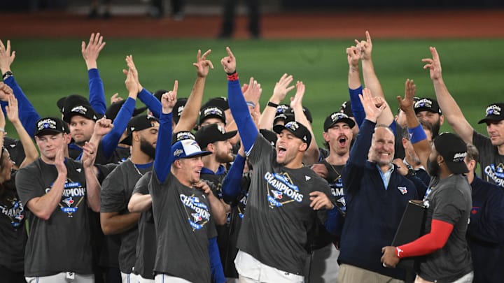 Toronto Blue Jays celebrate after winning game seven of the ALCS round for the MLB playoffs. Toronto Blue Jays celebrate after winning game seven of the ALCS round for the MLB playoffs.