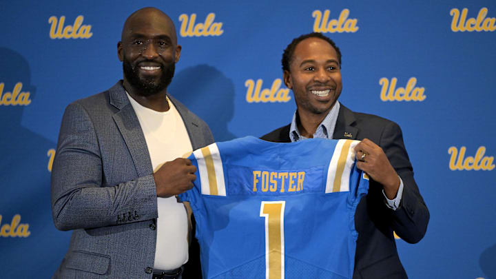 Feb 13, 2024; Los Angeles, CA, USA;  UCLA Bruins athletic director Martin Jarmond, right,  with new head football coach DeShaun Foster during a press conference at Pauley Pavilion.  Mandatory Credit: Jayne Kamin-Oncea-Imagn Images