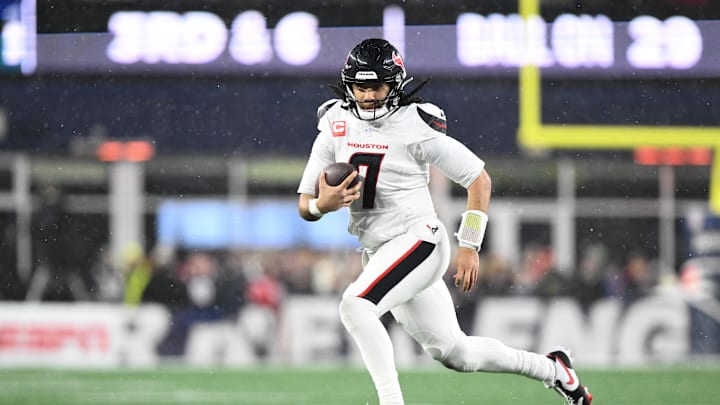 Jan 18, 2026; Foxborough, MA, USA; Houston Texans quarterback C.J. Stroud (7) runs with the ball in the third quarter against the New England Patriots in an AFC Divisional Round game at Gillette Stadium. Mandatory Credit: Brian Fluharty-Imagn Images