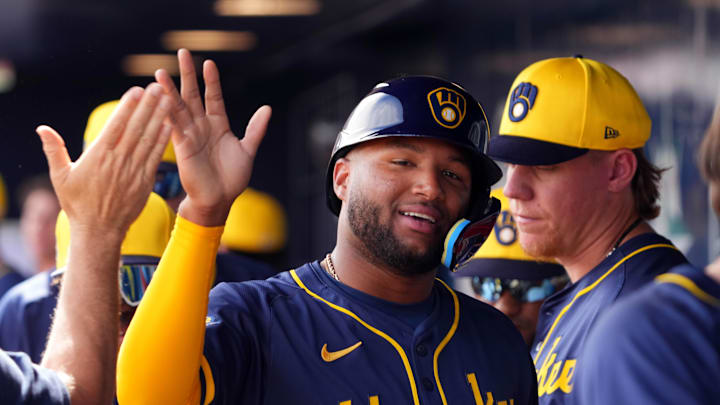 Feb 24, 2024; Peoria, Arizona, USA; Milwaukee Brewers center fielder Jackson Chourio (11) high fives