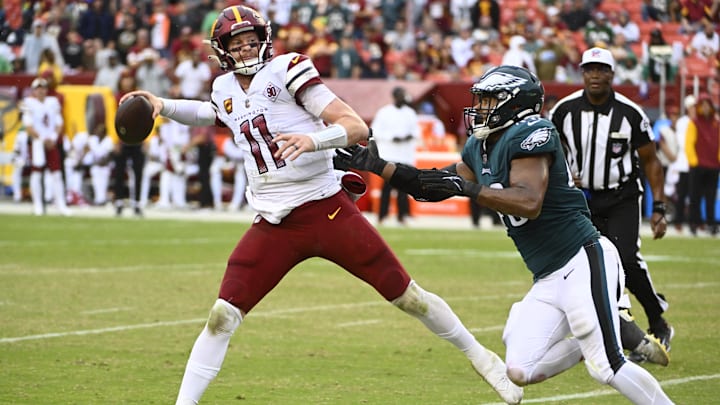 Sep 25, 2022; Landover, Maryland, USA; Philadelphia Eagles linebacker Patrick Johnson (48) pressures Washington Commanders quarterback Carson Wentz (11) during the second half at FedExField. Mandatory Credit: Brad Mills-Imagn Images