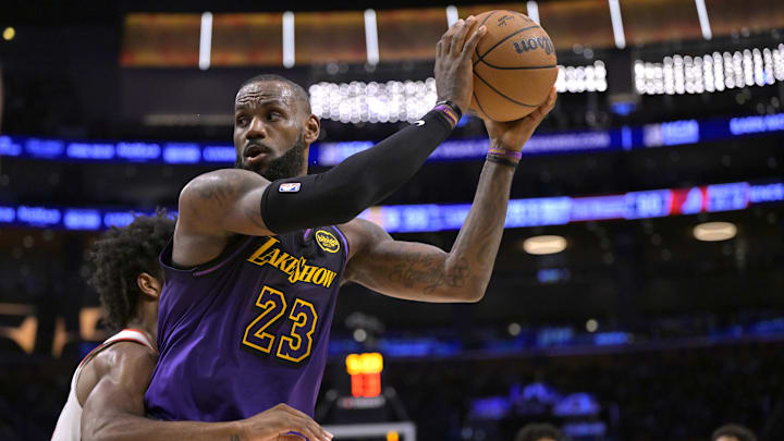 Jan 2, 2025; Los Angeles, California, USA;  Portland Trail Blazers guard Scoot Henderson (00) defends Los Angeles Lakers forward LeBron James (23) in the second half at Crypto.com Arena. Mandatory Credit: Jayne Kamin-Oncea-Imagn Images