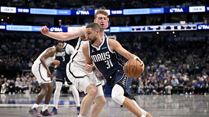 Dec 12, 2025; Dallas, Texas, USA; Dallas Mavericks guard Klay Thompson (31) drives to the basket past Brooklyn Nets forward Danny Wolf (2) during the second quarter at the American Airlines Center. Mandatory Credit: Jerome Miron-Imagn Images Dec 12, 2025; Dallas, Texas, USA; Dallas Mavericks guard Klay Thompson (31) drives to the basket past Brooklyn Nets forward Danny Wolf (2) during the second quarter at the American Airlines Center. Mandatory Credit: Jerome Miron-Imagn Images