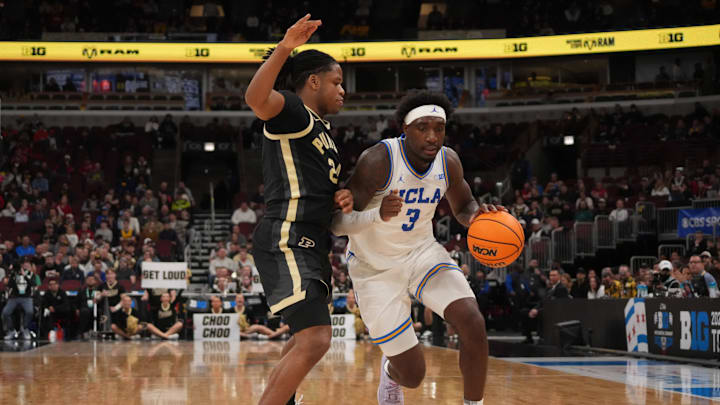 Mar 14, 2026; Chicago, IL, USA; Purdue Boilermakers guard Gicarri Harris (24) defends UCLA Bruins forward Eric Dailey Jr. (3) during the second half at United Center. Mandatory Credit: David Banks-Imagn Images