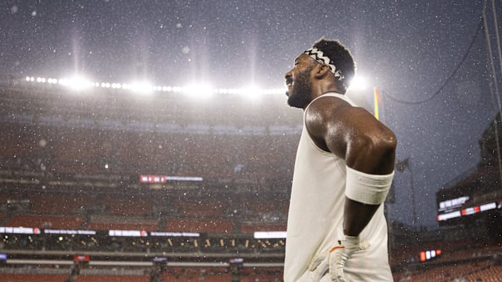 Aug 11, 2023; Cleveland, Ohio, USA; Cleveland Browns defensive end Myles Garrett (95) stands in the rain before the game against the Washington Commanders which was delayed due to severe weather at Cleveland Browns Stadium. Mandatory Credit: Scott Galvin-Imagn Images
