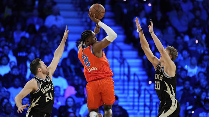 Dec 17, 2024; Las Vegas, Nevada, USA; Oklahoma City Thunder forward Jalen Williams (8) passes against Milwaukee Bucks guard Pat Connaughton (24) and Milwaukee Bucks guard AJ Green (20) during the 3rd quarter of the Emirates NBA Cup championship game at T-Mobile Arena. Mandatory Credit: Kyle Terada-Imagn Images