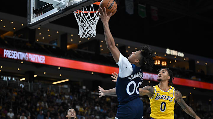 Oct 4, 2024; Palm Desert, California, USA; Minnesota Timberwolves guard Terrence Shannon Jr. (00) shoots a layup against Los Angeles Lakers guard Jalen Hood-Schifino (0) during the second half at Acrisure Arena. Mandatory Credit: Jonathan Hui-Imagn Images