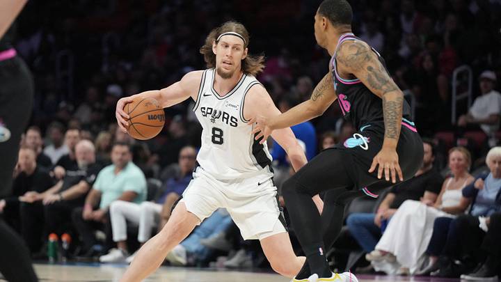 Mar 23, 2026; Miami, Florida, USA; San Antonio Spurs forward Kelly Olynyk (8) brings the ball up the court as Miami Heat forward Keshad Johnson (16) defends during the second half at Kaseya Center. Mar 23, 2026; Miami, Florida, USA; San Antonio Spurs forward Kelly Olynyk (8) brings the ball up the court as Miami Heat forward Keshad Johnson (16) defends during the second half at Kaseya Center.
