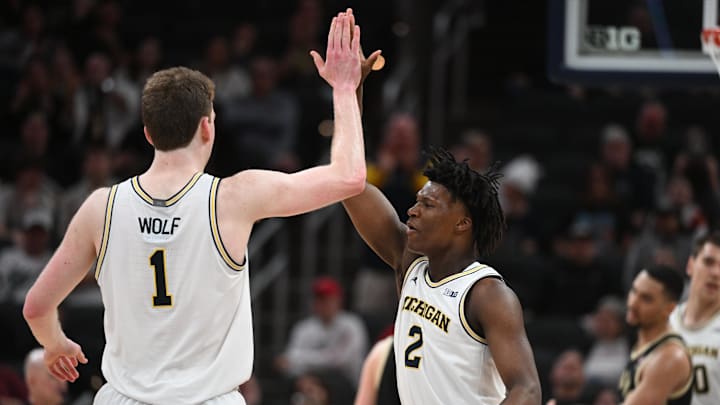 Mar 14, 2025; Indianapolis, IN, USA; Michigan Wolverines center Danny Wolf (1) and guard L.J. Cason (2) celebrate after a play during the second half against the Purdue Boilermakers at Gainbridge Fieldhouse. Mandatory Credit: Robert Goddin-Imagn Images