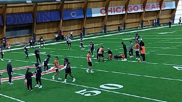 Caleb Williams and QBs  run through handoff drills during OTAs.