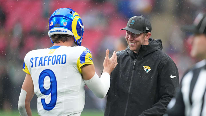 Oct 19, 2025; London, United Kingdom; Los Angeles Rams quarterback Matthew Stafford (9) shakes hands with Jacksonville Jaguars head coach Liam Coen before a NFL International Series game between the Los Angeles Rams and the Jacksonville Jaguars at Wembley Stadium. Mandatory Credit: Kirby Lee-Imagn Images