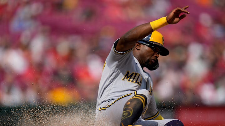 Milwaukee Brewers second baseman Andruw Monasterio (14) crosses the plate on a Blake Perkins single
