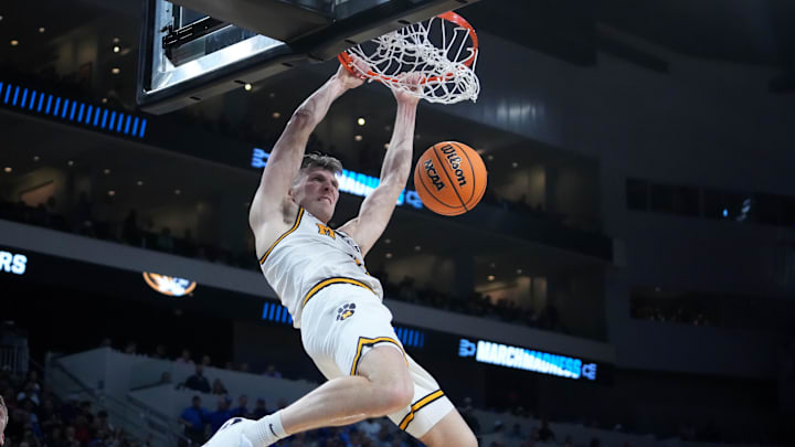 Mar 20, 2025; Wichita, KS, USA; Missouri Tigers guard Caleb Grill (31) dunks in the second half of a first round men’s NCAA Tournament game against the Drake Bulldogs at Intrust Bank Arena. Mandatory Credit: Kirby Lee-Imagn Images