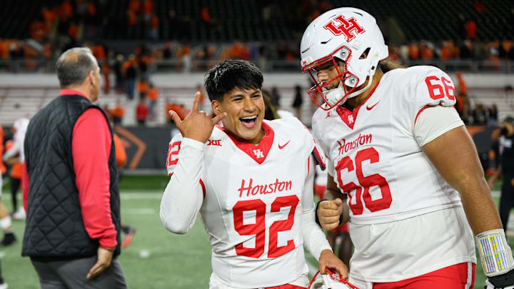 Sep 26, 2025; Corvallis, Oregon, USA; Houston Cougars place kicker Ethan Sanchez (92) celebrates with offensive lineman McKenzie Agnello (66) after an overtime win against the Oregon State Beavers at Reser Stadium. Mandatory Credit: Craig Strobeck-Imagn Images