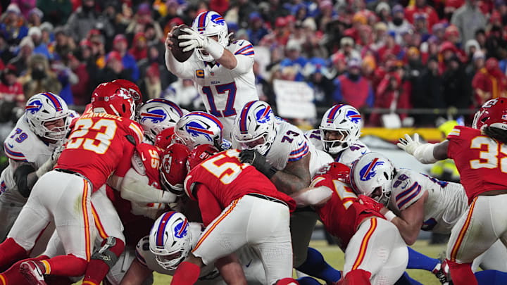 Buffalo Bills quarterback Josh Allen (17) reaches for a first down against the Kansas City Chiefs during the second half in the AFC Championship game at GEHA Field at Arrowhead Stadium.
