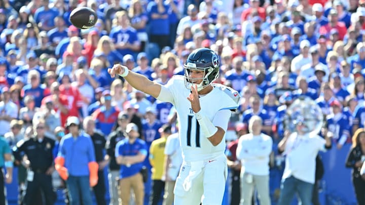Oct 20, 2024; Orchard Park, New York, USA; Tennessee Titans quarterback Mason Rudolph (11) throws a pass in the first quarter against the Buffalo Bills at Highmark Stadium. Mandatory Credit: Mark Konezny-Imagn Images