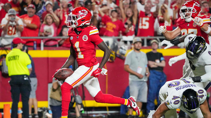 Sep 5, 2024; Kansas City, Missouri, USA; Kansas City Chiefs wide receiver Xavier Worthy (1) scores a touchdown as Baltimore Ravens linebacker Malik Harrison (40) misses the tackle during the first half at GEHA Field at Arrowhead Stadium. Mandatory Credit: Denny Medley-Imagn Images