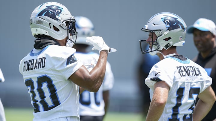 Jun 11, 2025; Charlotte, NC, USA; Carolina Panthers running back Chuba Hubbard (30) talks with wide receiver Hunter Renfrow (13) during minicamp at Bank of America Stadium. Mandatory Credit: Jim Dedmon-Imagn Images