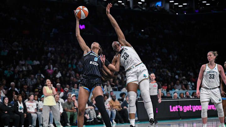 Aug 21, 2025; Brooklyn, New York, USA; Chicago Sky forward Angel Reese (5) receives a pass in the low post as New York Liberty forward Kennedy Burke (22) defends during the first half at Barclays Center. Mandatory Credit: John Jones-Imagn Images