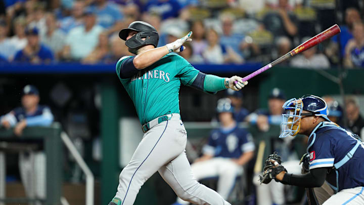 Seattle Mariners first baseman Ty France (23) hits a double during the eighth inning against the Kansas City Royals at Kauffman Stadium on June 7.