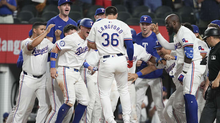 Sep 3, 2024; Arlington, Texas, USA; Texas Rangers center fielder Wyatt Langford (36) arrives home to teammates on his grand slam walk-off against the New York Yankees during the ninth inning at Globe Life Field. Mandatory Credit: Jim Cowsert-Imagn Images Sep 3, 2024; Arlington, Texas, USA; Texas Rangers center fielder Wyatt Langford (36) arrives home to teammates on his grand slam walk-off against the New York Yankees during the ninth inning at Globe Life Field. Mandatory Credit: Jim Cowsert-Imagn Images