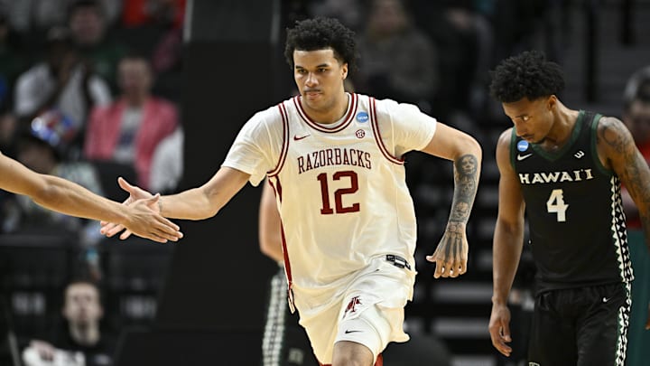 Mar 19, 2026; Portland, OR, USA; Arkansas Razorbacks forward Malique Ewin (12) celebrates after a basket in the first half against the Hawaii Rainbow Warriors during a first round game of the men's 2026 NCAA Tournament at Moda Center. Mandatory Credit: Craig Strobeck-Imagn Images